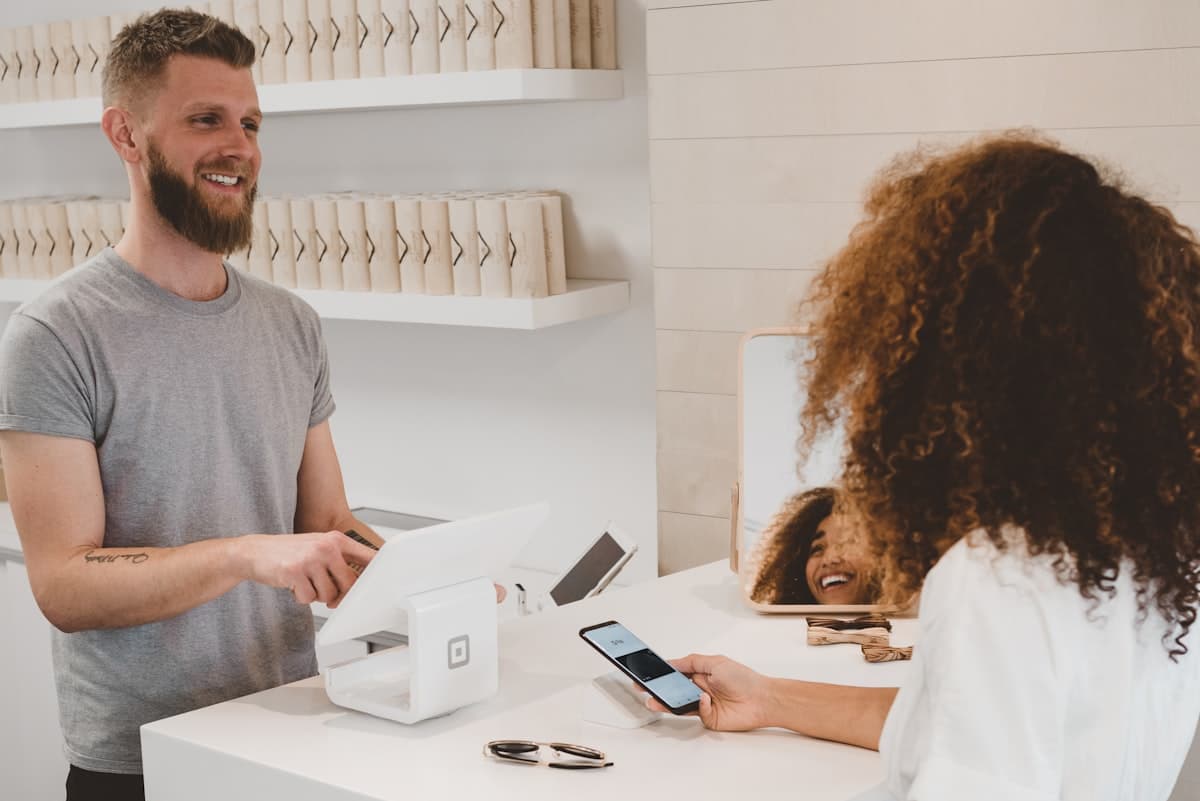 Customer paying with a phone at a card terminal